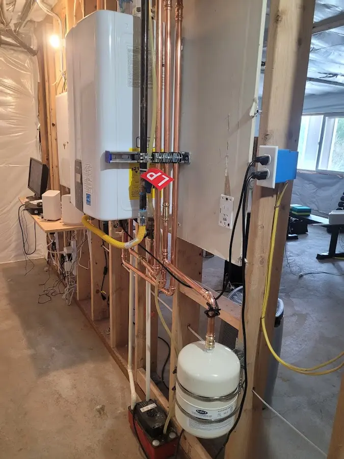Licensed plumber repairing a kitchen sink in Wakefield